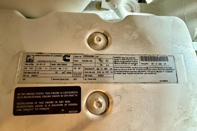  Yacht Photos Pics Engine label on 2014 Meridian 391 Sedan, featuring Cummins specifications and warnings.