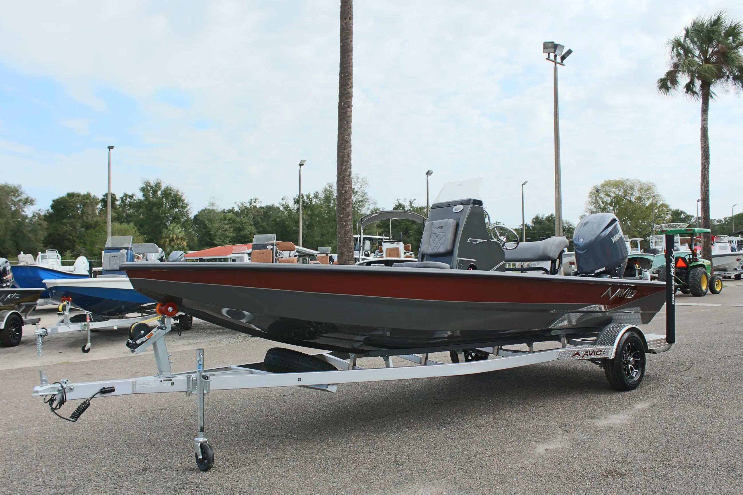 2025 Avid 21 FSX boat on trailer in outdoor setting.