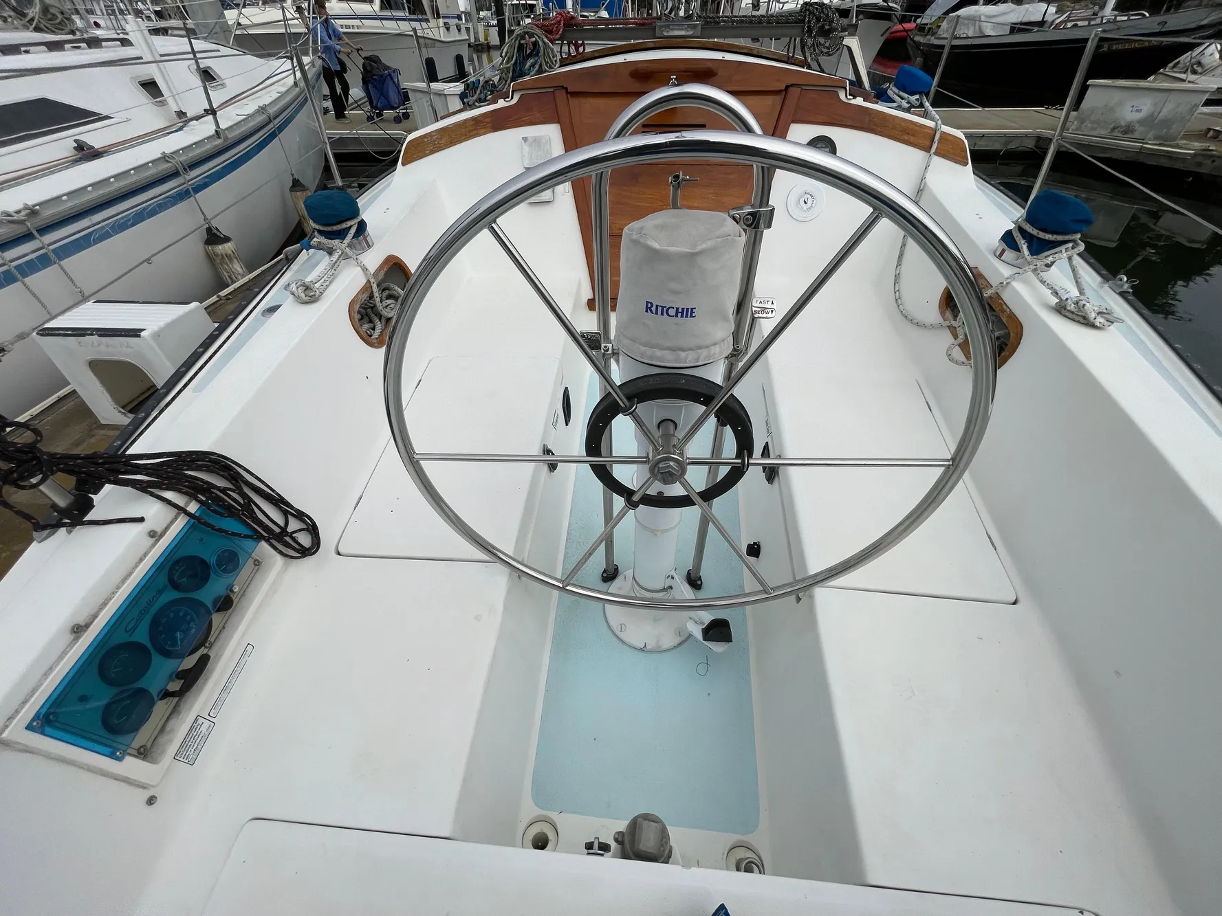 1984 Catalina 30 sailboat cockpit with steering wheel and navigation instruments.