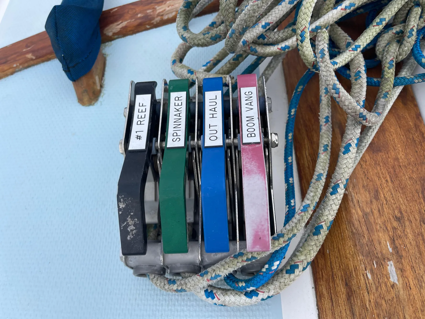 Sailing control lines on a 1984 Catalina 30, labeled for reef, spinnaker, outhaul, and boom vang.