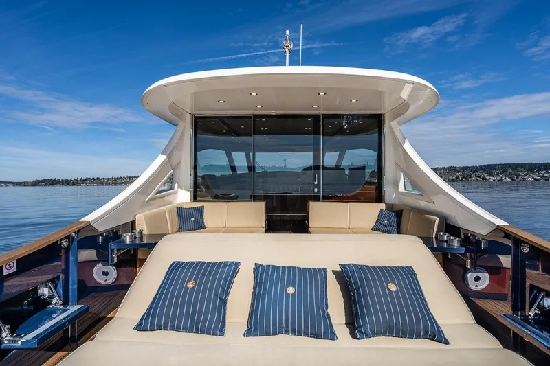  Yacht Photos Pics Luxurious 2022 Filippetti Classic 54 yacht with elegant seating and scenic ocean view.