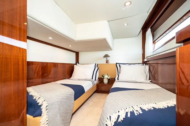  Yacht Photos Pics Luxurious twin cabin interior of 2022 Filippetti Classic 54 yacht with elegant wood finish.