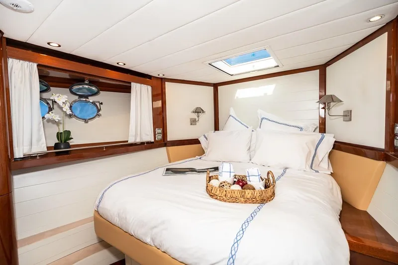  Yacht Photos Pics Luxurious cabin interior of 2022 Filippetti Classic 54 yacht with cozy bed and skylight.