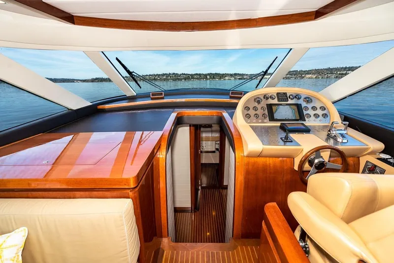  Yacht Photos Pics Interior view of 2022 Filippetti Classic 54 yacht cockpit with luxurious wood finish.