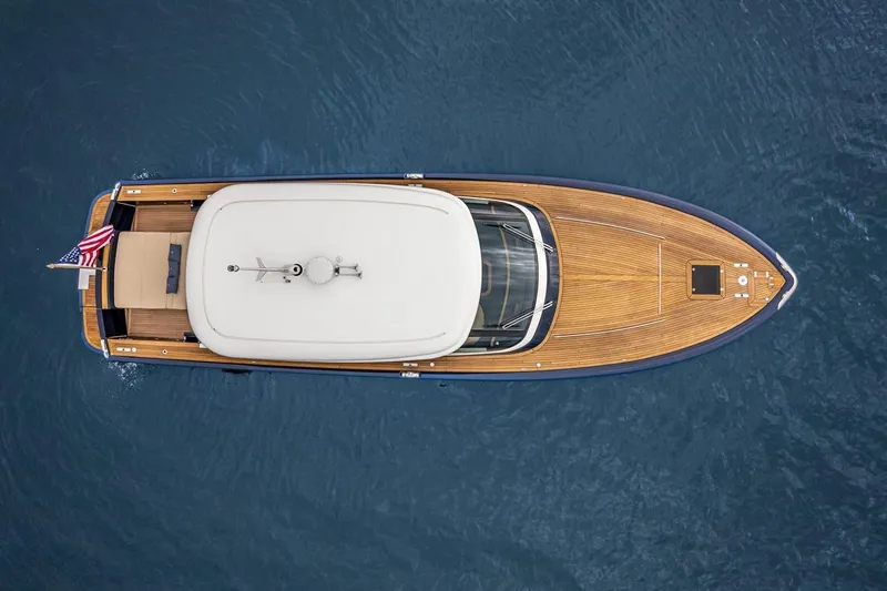  Yacht Photos Pics Aerial view of 2022 Filippetti Classic 54 yacht on open water.