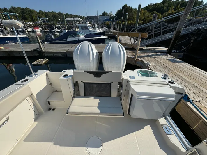  Yacht Photos Pics 2023 Sailfish 312 CC boat with dual engines docked at a marina.