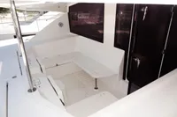 2017 Leopard 51 Powercat cockpit seating area with table and storage.