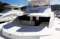 2017 Leopard 51 Powercat yacht docked in a marina under a clear blue sky.