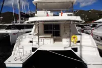 2017 Leopard 51 Powercat yacht docked at marina with mountainous backdrop.