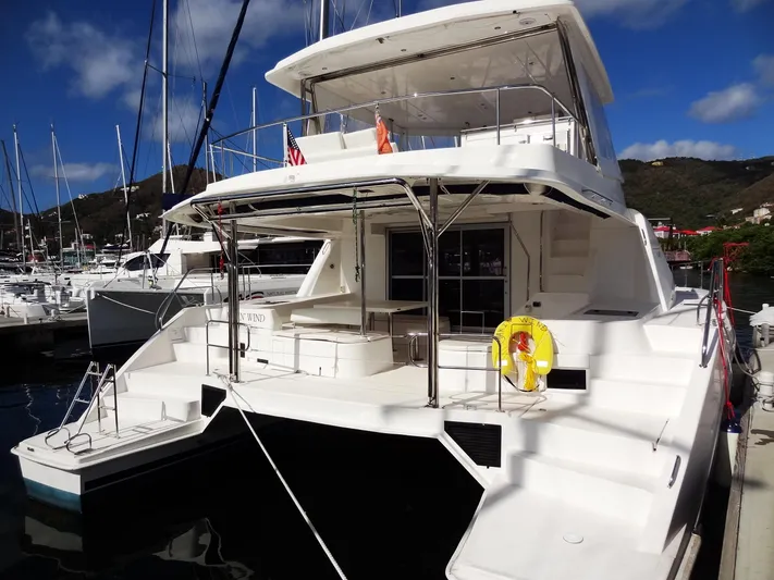 Makin Wind Yacht Photos Pics 2017 Leopard 51 Powercat docked at a marina, rear view.
