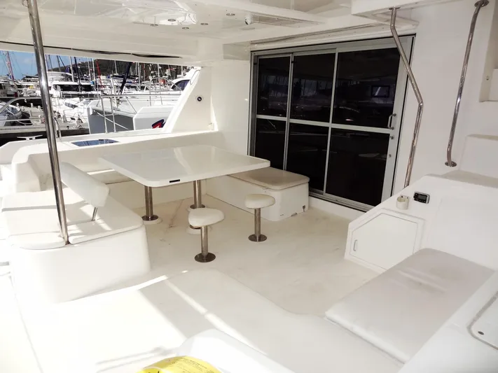 Makin Wind Yacht Photos Pics 2017 Leopard 51 Powercat yacht interior with seating and dining area.