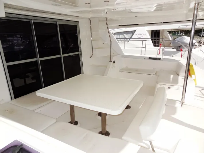 Makin Wind Yacht Photos Pics 2017 Leopard 51 Powercat yacht with spacious outdoor seating and dining area.
