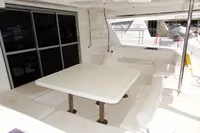 2017 Leopard 51 Powercat yacht with spacious outdoor seating and dining area.