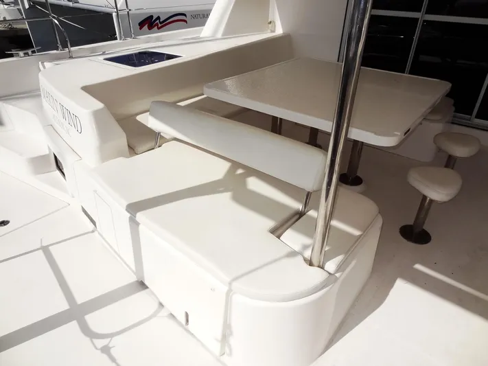 Makin Wind Yacht Photos Pics 2017 Leopard 51 Powercat outdoor seating and dining area.