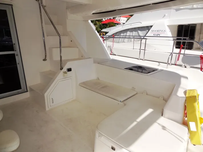 Makin Wind Yacht Photos Pics 2017 Leopard 51 Powercat yacht interior with seating and stairs.