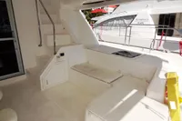 2017 Leopard 51 Powercat yacht interior with seating and stairs.
