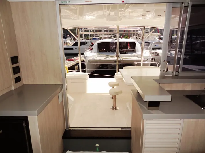 Makin Wind Yacht Photos Pics Interior view of 2017 Leopard 51 Powercat yacht with open rear deck.