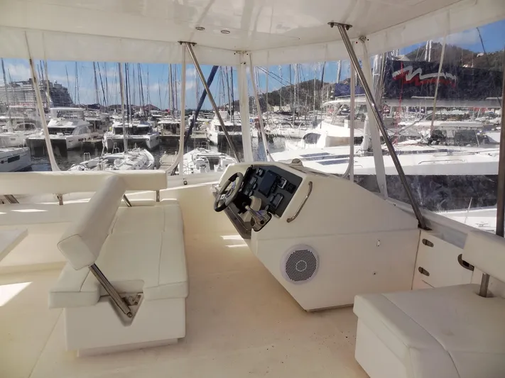 Makin Wind Yacht Photos Pics 2017 Leopard 51 Powercat helm station with marina view.