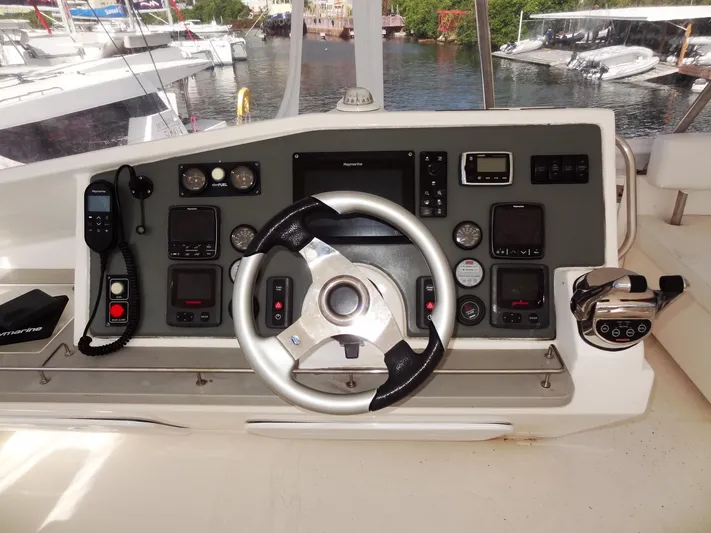Makin Wind Yacht Photos Pics Helm station of a 2017 Leopard 51 Powercat with navigation and control instruments.