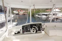 Leopard 51 Powercat 2017 helm station with marina view.