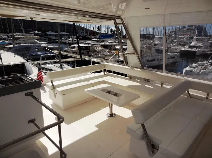 Makin Wind Yacht Photos Pics 2017 Leopard 51 Powercat yacht with spacious seating area at marina.
