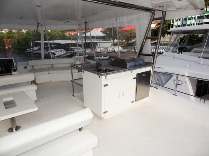 Makin Wind Yacht Photos Pics Leopard 51 Powercat 2017 yacht with spacious outdoor seating and grill area.
