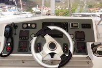 2017 Leopard 51 Powercat helm with steering wheel and navigation controls.