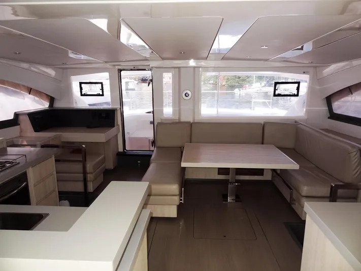 Makin Wind Yacht Photos Pics Interior of 2017 Leopard 51 Powercat with modern kitchen and spacious seating area.