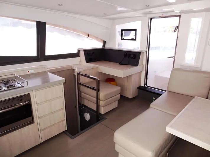 Makin Wind Yacht Photos Pics Interior of 2017 Leopard 51 Powercat with modern kitchen and seating area.