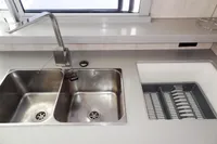 Modern kitchen sink area on a 2017 Leopard 51 Powercat yacht.