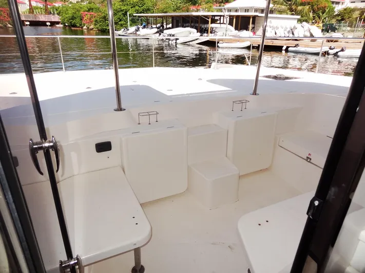 Makin Wind Yacht Photos Pics 2017 Leopard 51 Powercat boat interior with seating area and waterfront view.