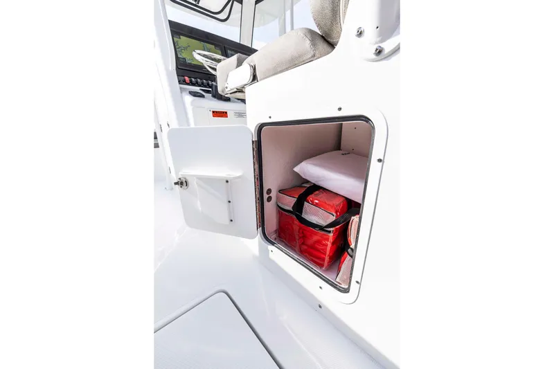  Yacht Photos Pics Storage compartment on 2026 Sea Hunt Gamefish 28 Forward Seating boat, featuring safety gear.