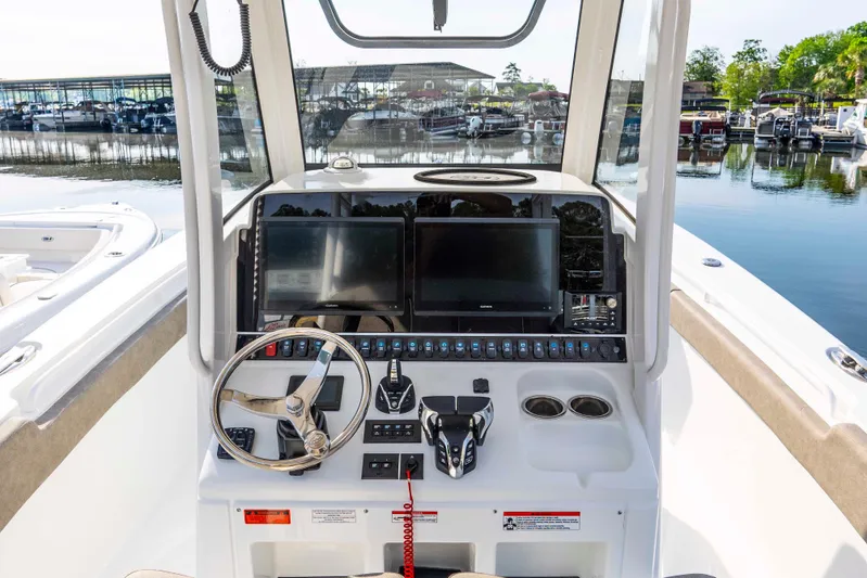  Yacht Photos Pics 2026 Sea Hunt Gamefish 28 helm with dual screens and modern controls at marina.