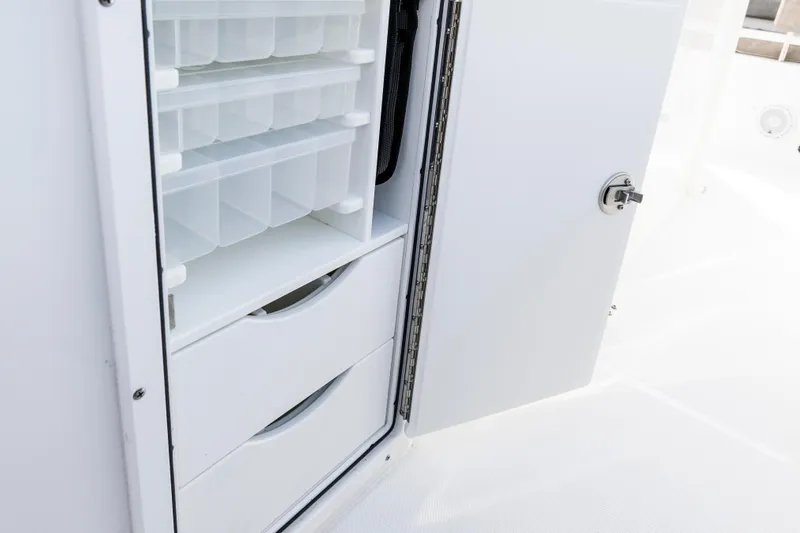  Yacht Photos Pics Storage compartment on 2026 Sea Hunt Gamefish 28 Forward Seating boat.