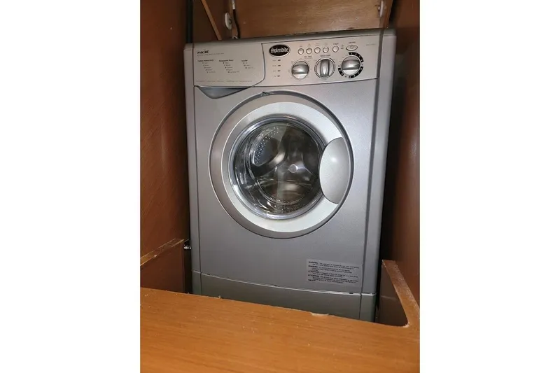 Yacht Photos Pics Front-loading washing machine, Prestige 500 S, 2013 model, in a wooden cabinet.