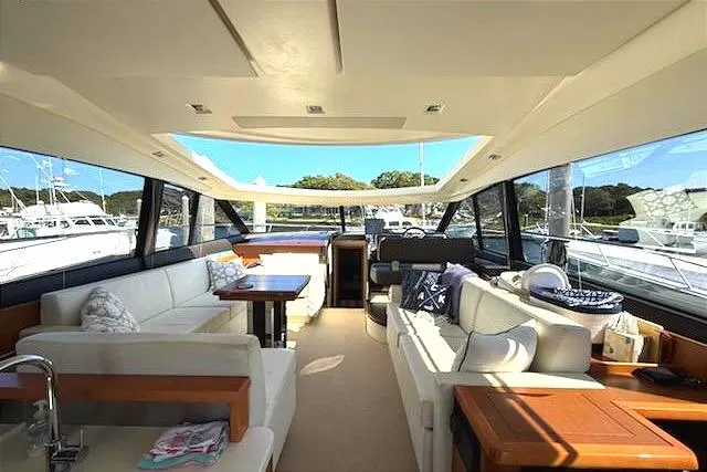  Yacht Photos Pics Luxurious interior of 2013 Prestige 500 S yacht with spacious seating and panoramic windows.