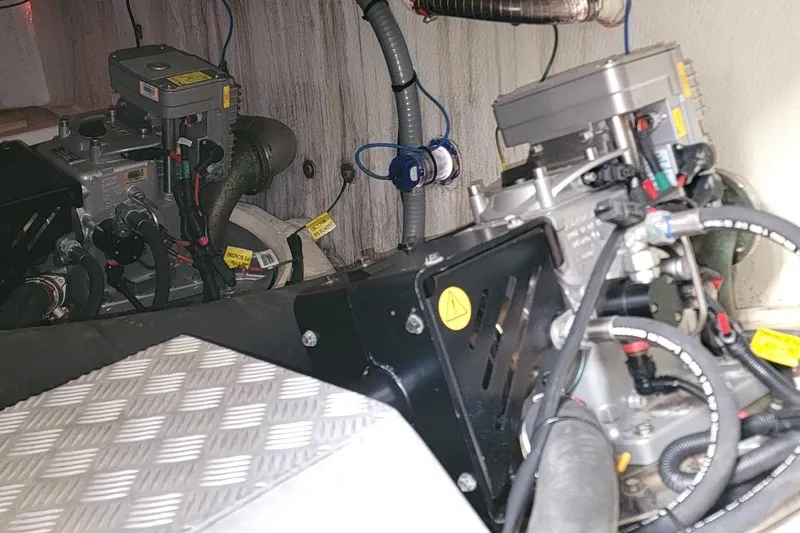  Yacht Photos Pics Engine room of a 2013 Prestige 500 S yacht, showcasing mechanical components and wiring.