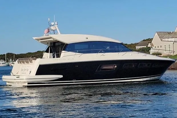  Yacht Photos Pics Luxury 2013 Prestige 500S yacht cruising near coastal homes.