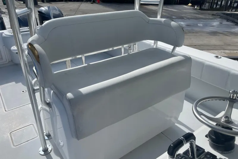  Yacht Photos Pics 2016 Contender 39 ST boat interior with white seating and steering wheel.
