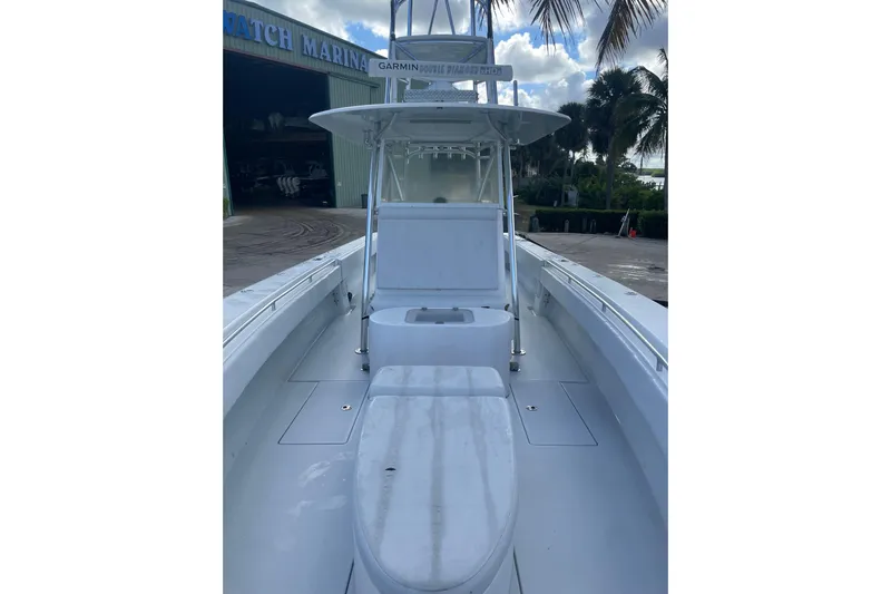  Yacht Photos Pics 2016 Contender 39 ST boat with center console, docked near marina.