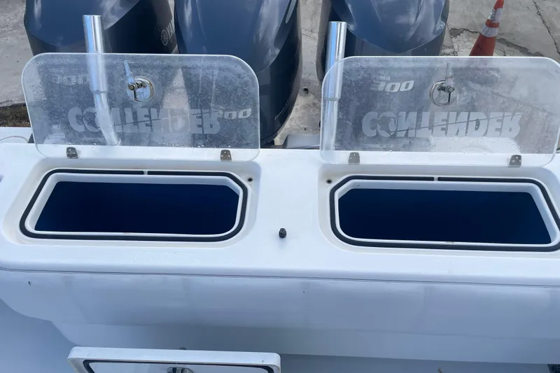  Yacht Photos Pics Open storage compartments on a 2016 Contender 39 ST boat with Yamaha engines.