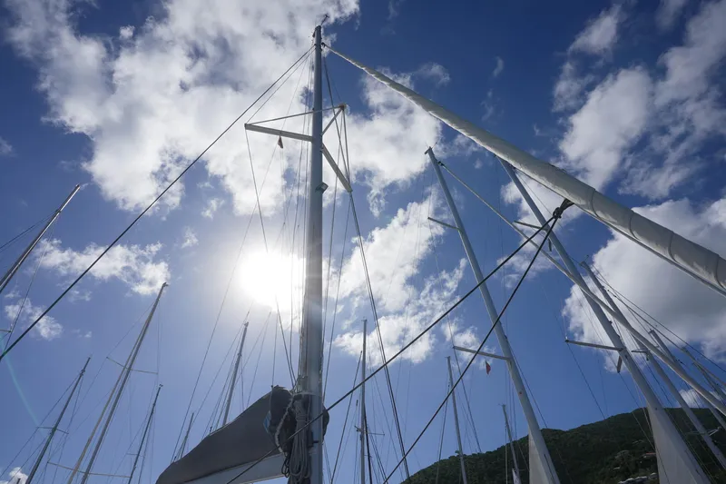 Firefly Yacht Photos Pics Sailboat masts against a bright blue sky, Fountaine Pajot Isla 40, 2023 model.