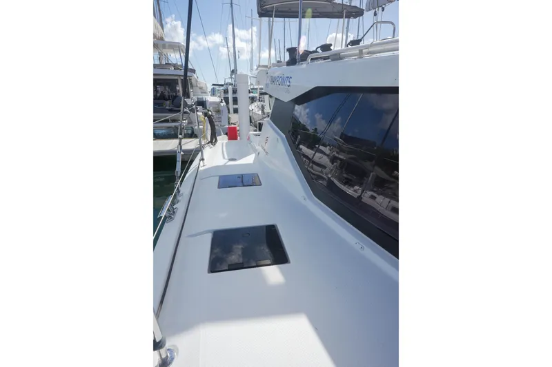 Firefly Yacht Photos Pics 2023 Fountaine Pajot Isla 40 catamaran deck view with sleek design and modern features.