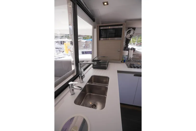 Firefly Yacht Photos Pics Modern kitchen interior of 2023 Fountaine Pajot Isla 40 catamaran.