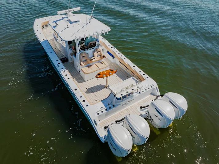  Yacht Photos Pics 2025 Freeman 38 boat with four engines cruising on open water.