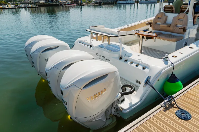  Yacht Photos Pics Freeman 38 boat with four powerful outboard motors docked at a marina, 2025 model.