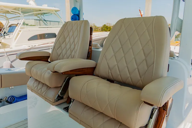  Yacht Photos Pics Luxurious seating on a 2025 Freeman 38 boat with diamond-stitched upholstery.