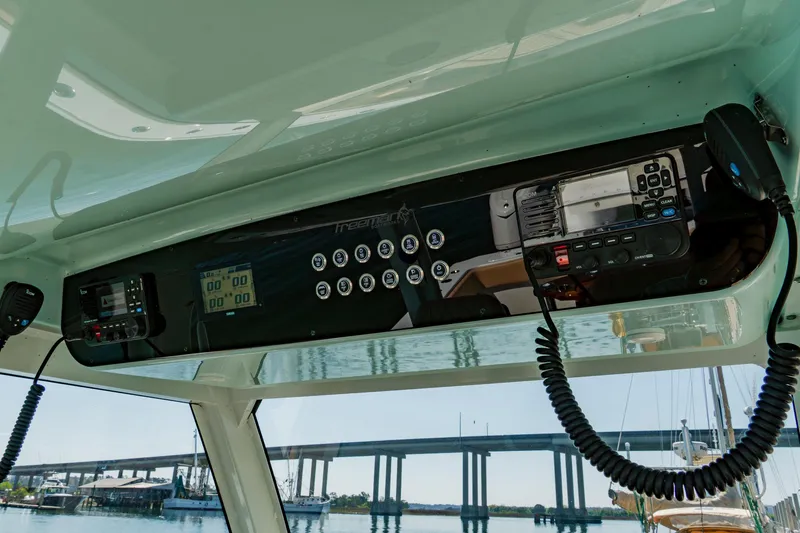  Yacht Photos Pics Interior view of Freeman 38 boat dashboard, featuring modern controls and communication equipment, 2025 model.