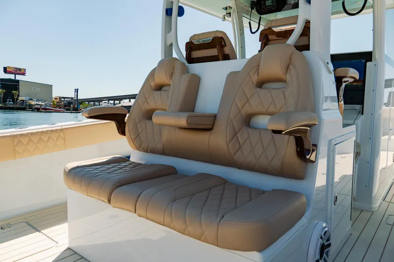  Yacht Photos Pics Luxurious seating on a 2025 Freeman 38 boat, featuring tan leather upholstery and modern design.