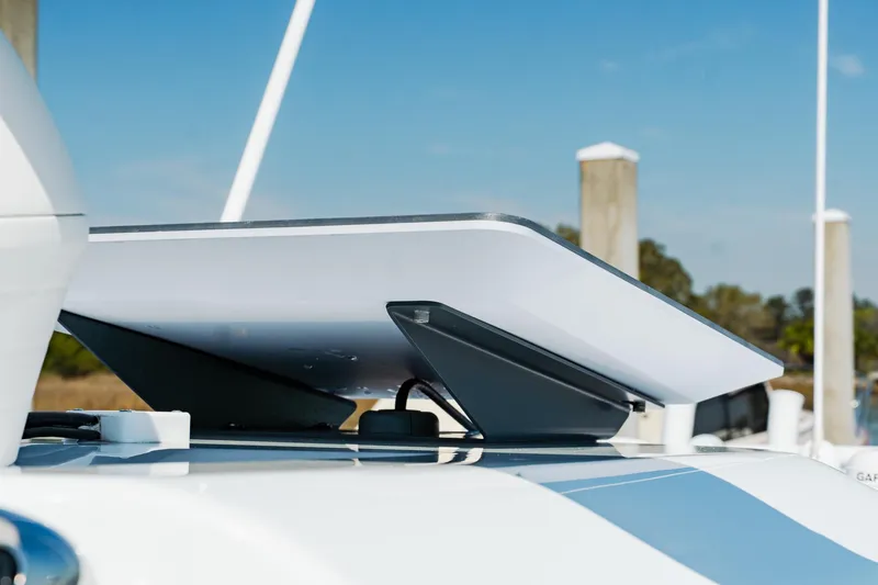  Yacht Photos Pics Rooftop satellite dish on Freeman 38 boat, 2025 model, docked at marina.
